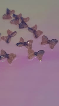 Image 2 of UV bow charm 