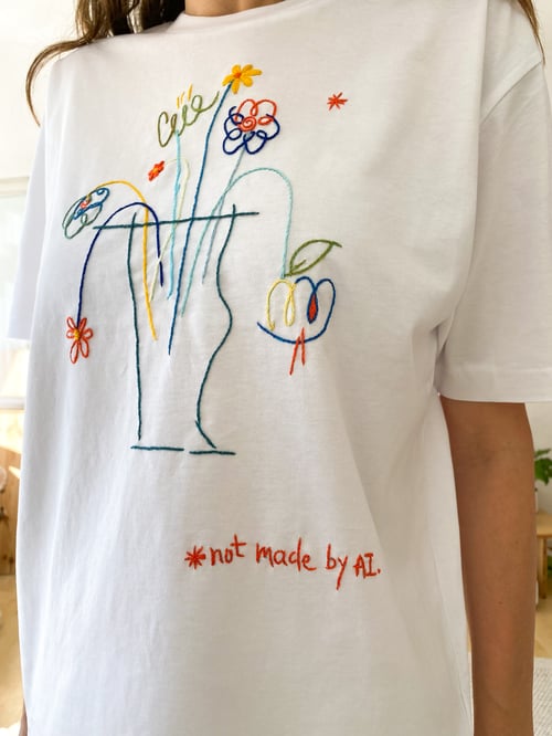Image of Not made by AI, original hand embroidery on organic cotton t-shirt, unisex