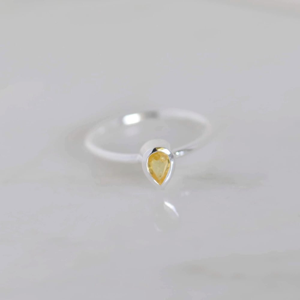 Image of Sri Lanka Honey Yellow Sapphire pear cut classic silver ring