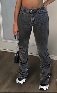 STACKED DISTRESSED JEANS