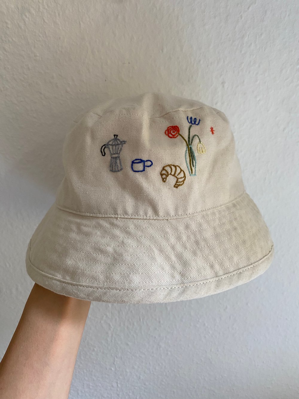 Image of Saturday morning  - hand embroidered bucket hat, not made by AI, unisex, available in XS-S / M-L