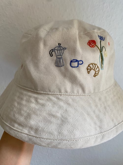 Image of Saturday morning  - hand embroidered bucket hat, not made by AI, unisex, available in XS-S / M-L