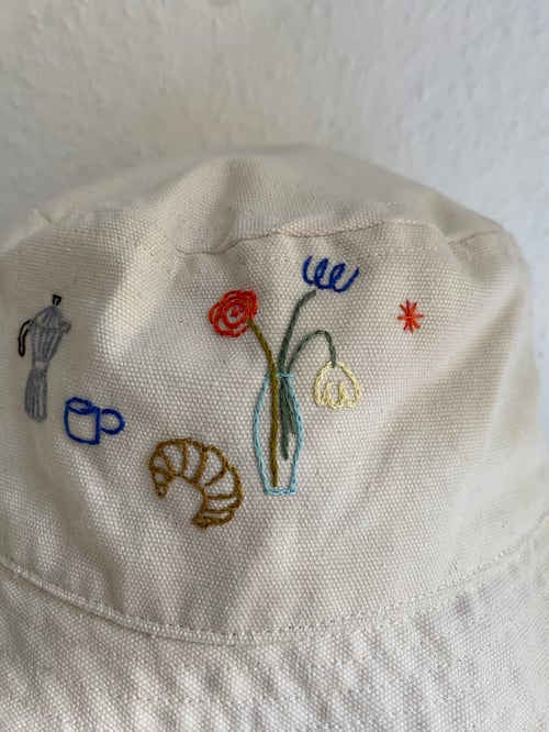 Image of Saturday morning  - hand embroidered bucket hat, not made by AI, unisex, available in XS-S / M-L