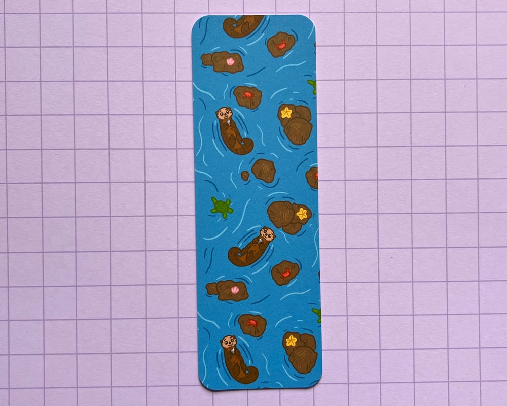 Image of Otter with a rock bookmark