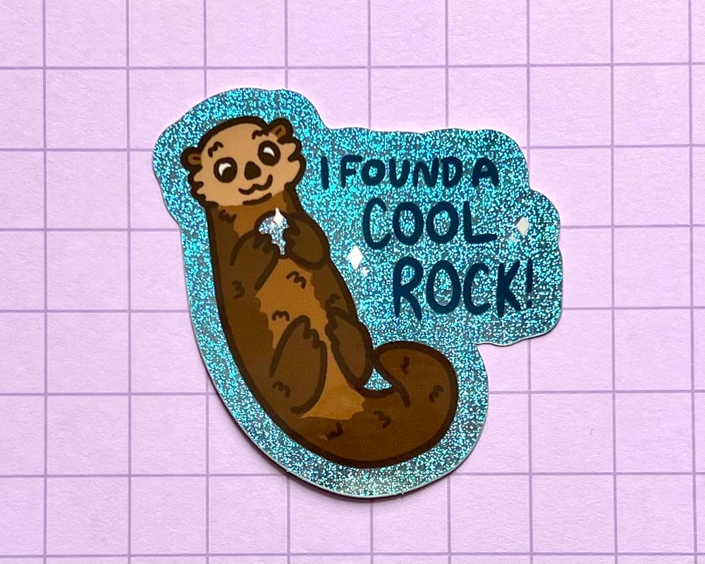 Image of Otter with a rock holographic glitter sticker