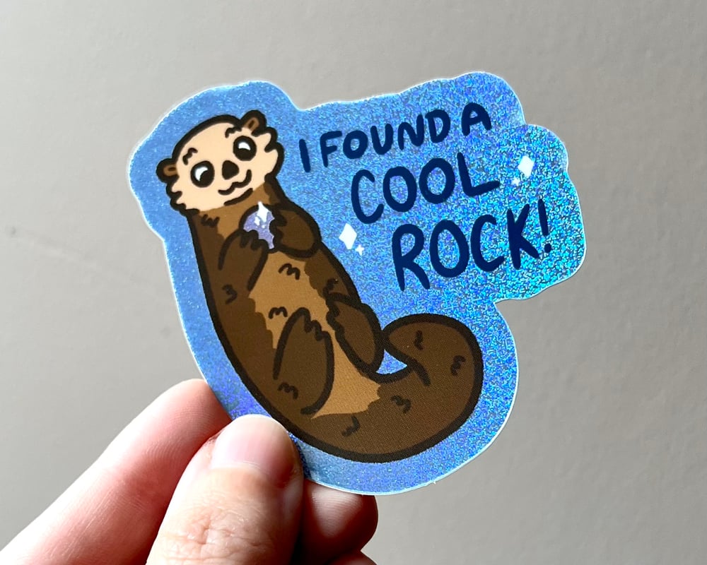Image of Otter with a rock holographic glitter sticker