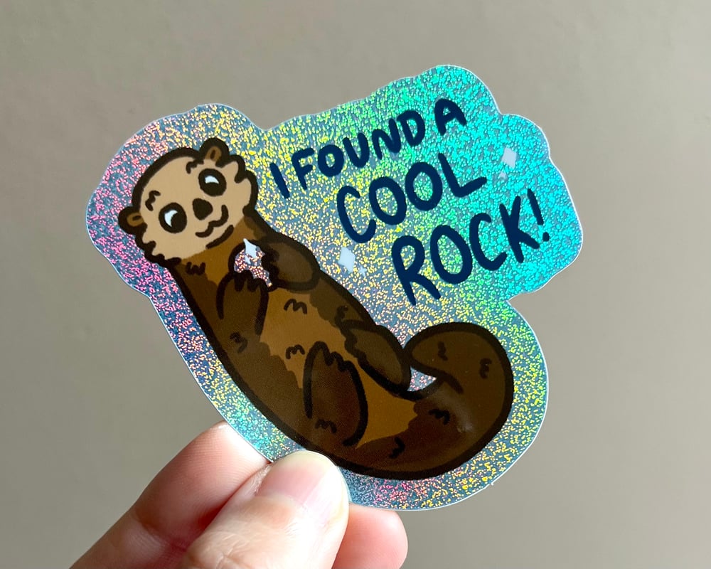 Image of Otter with a rock holographic glitter sticker