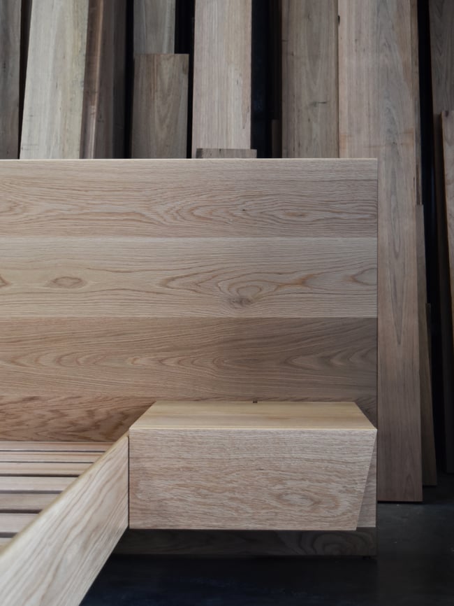 FLOATING BED WITH CLIPPED WING DRAWERS IN AMERICAN OAK