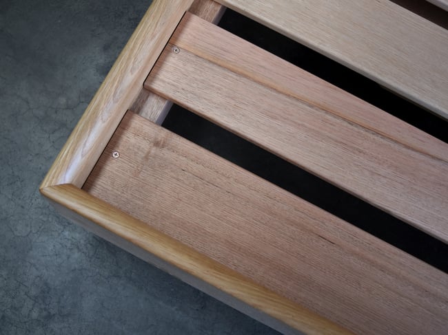 FLOATING BED WITH CLIPPED WING DRAWERS IN AMERICAN OAK