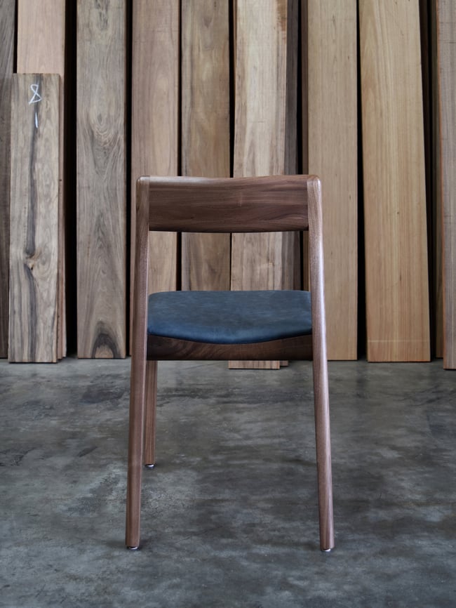 ROSE DINING CHAIR IN AMERICAN WALNUT WITH AN UPHOLSTERED LEATHER SEAT