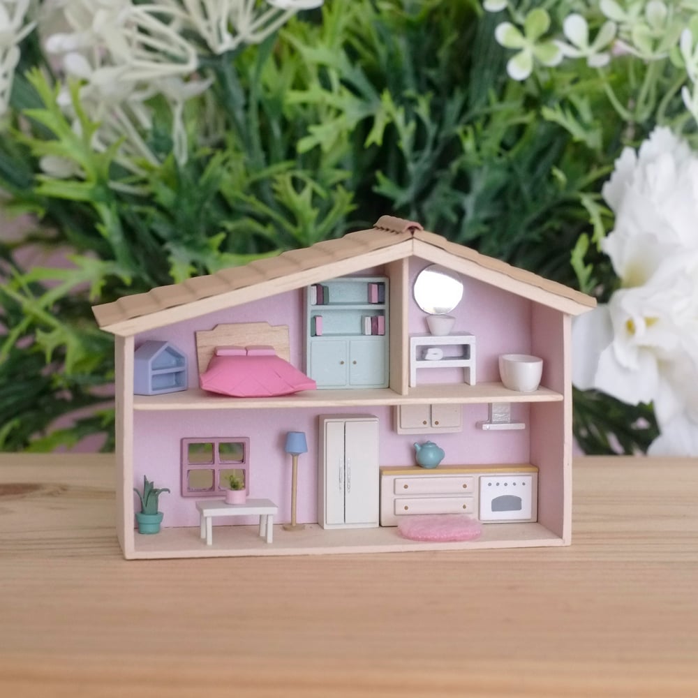 Tiny pink dollhouse