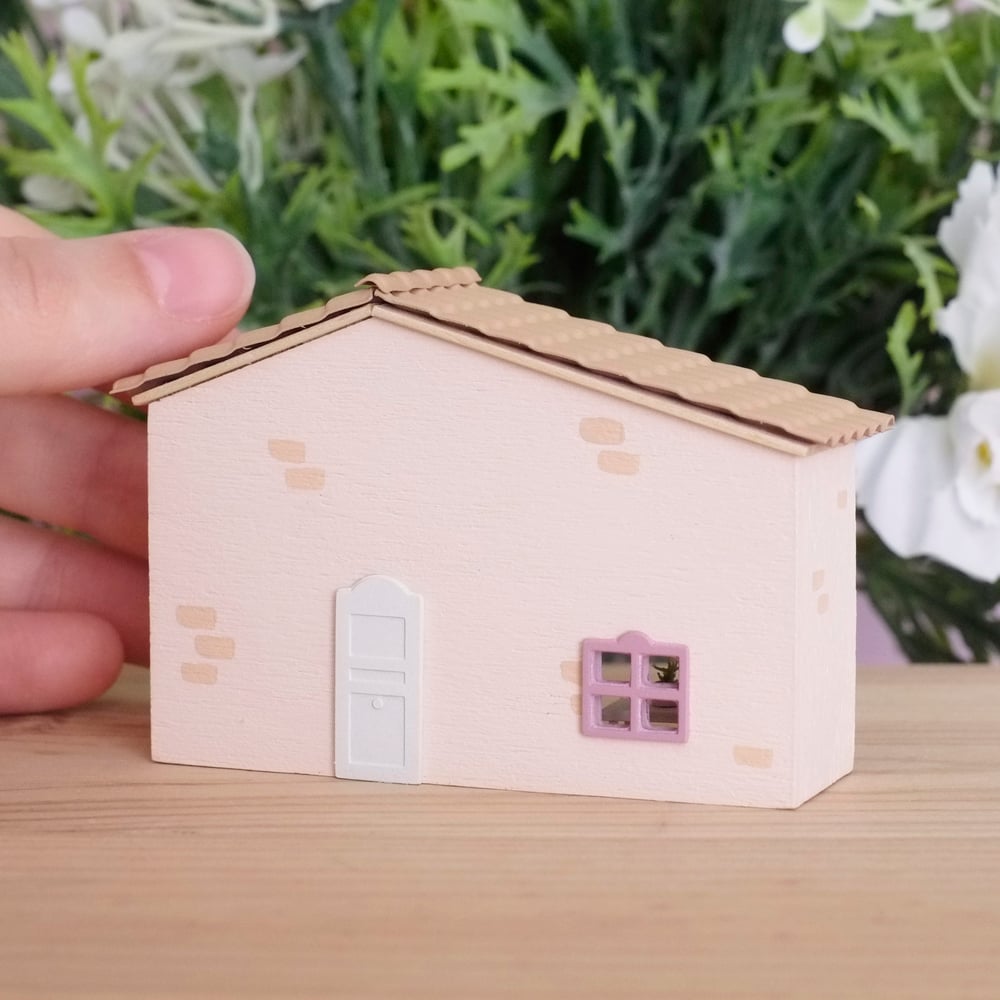 Tiny pink dollhouse