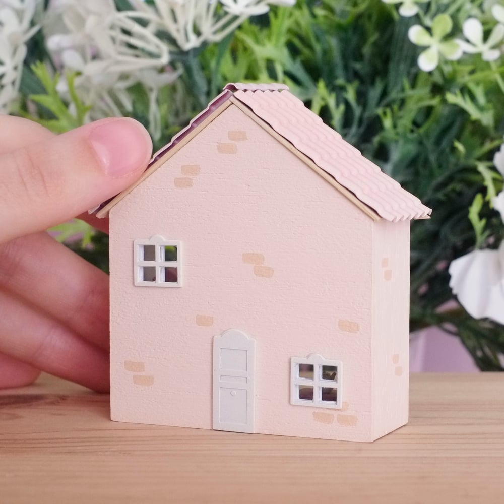 Tiny beige dollhouse