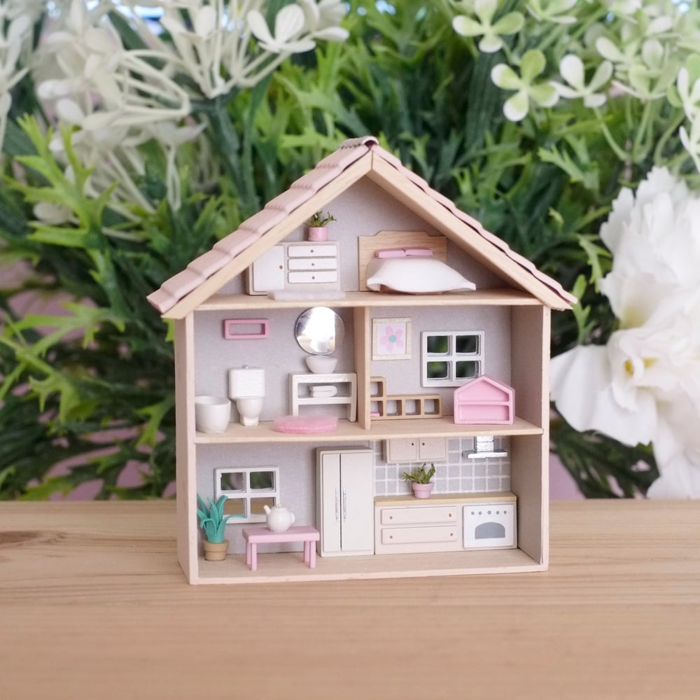 Tiny beige dollhouse