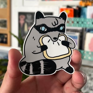 Image of Raccoon Eating Sliced Bread Sticker