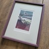 View beyond original linocut collage in frame
