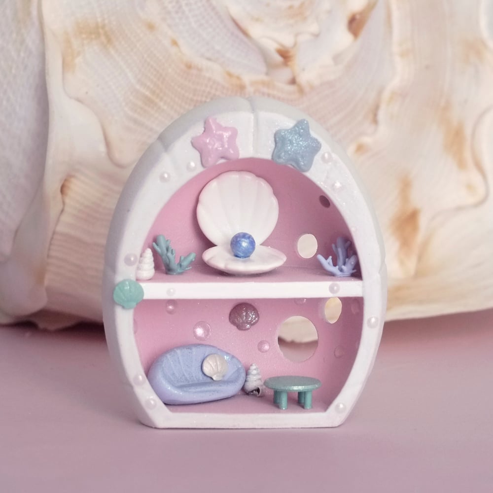 Pink miniature shell house