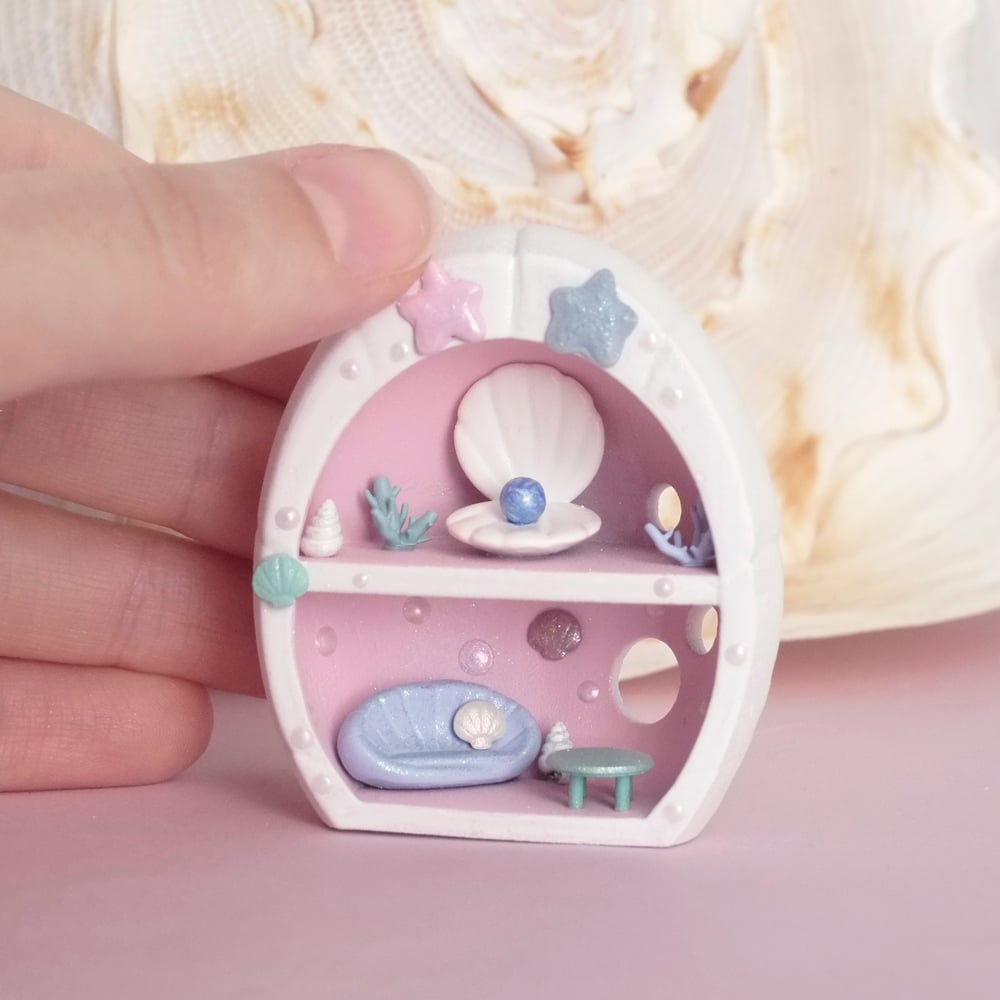 Pink miniature shell house