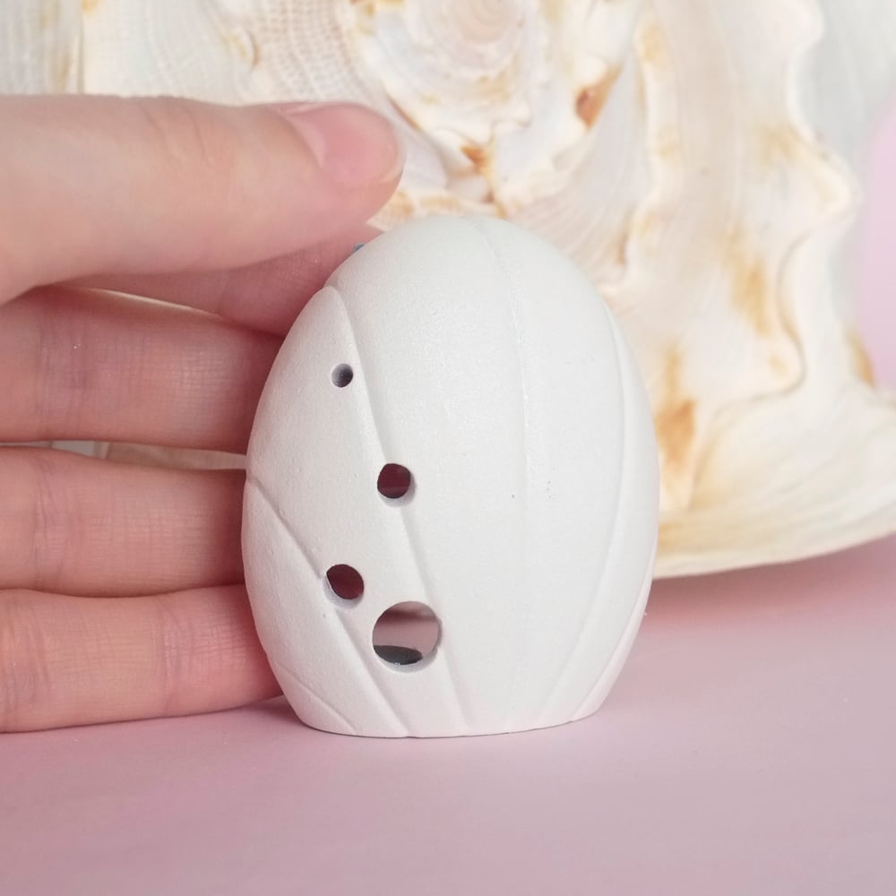 Pink miniature shell house