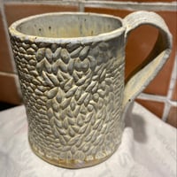 Very pretty knitted mug