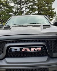 Image 1 of 2015-2018 RAM REBEL Vinyl Badge Grille Overlay Stars & Stripes Edition