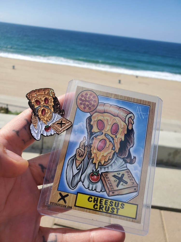 Image of Original Cheesus Crust lapel with matching collectable card in protective sleeve