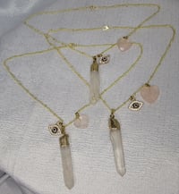 Image 2 of Gold tone 16in necklace, with 2 chams 