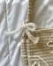 Image of pearlescent bow shoulder bag