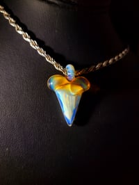 Image 1 of White (rhino) & orange elvis shark tooth pendant.