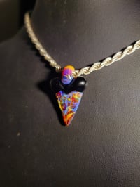 Image 1 of Amber purple & jet black shark tooth pendant. 