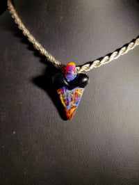 Image 2 of Amber purple & jet black shark tooth pendant. 