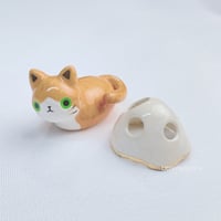 Image 1 of Orange loaf cat with ghost mask ceramic figurine