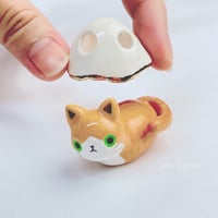 Image 2 of Orange loaf cat with ghost mask ceramic figurine