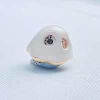 Image 3 of tiny budgie with ghost mask ceramic figurine (glow in dark) 