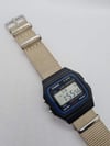 Retro Casio F91W Watch, on a beige desert NATO Strap