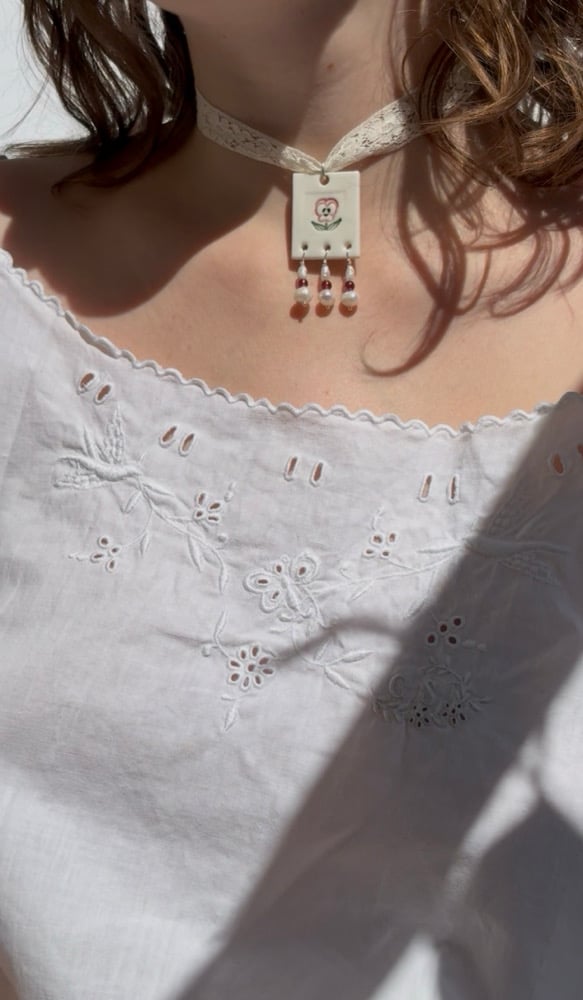 Image of porcelain and pearls pendants