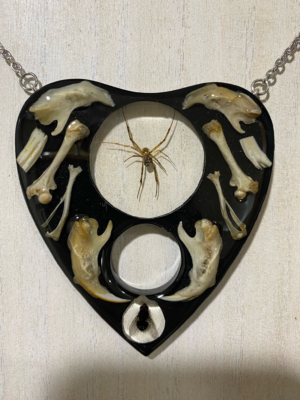 Juvenile black widow and bone oujia planchette pendant 