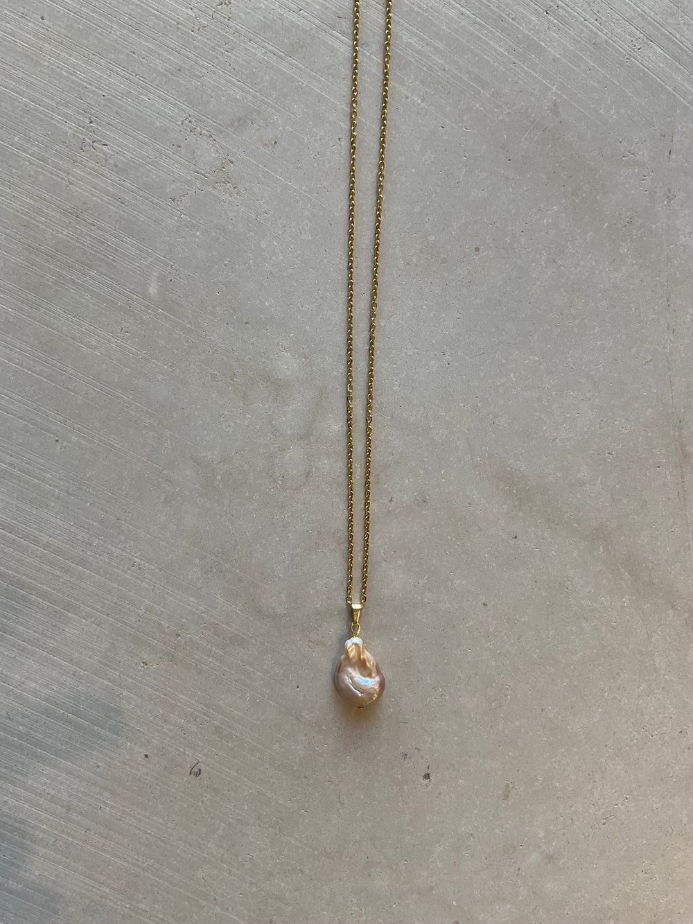 Gold necklace with sweet water pearl