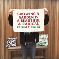 Growing a garden is a beautiful and radical act wall hanging