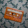 "Spill The Beans" Audio Cassette