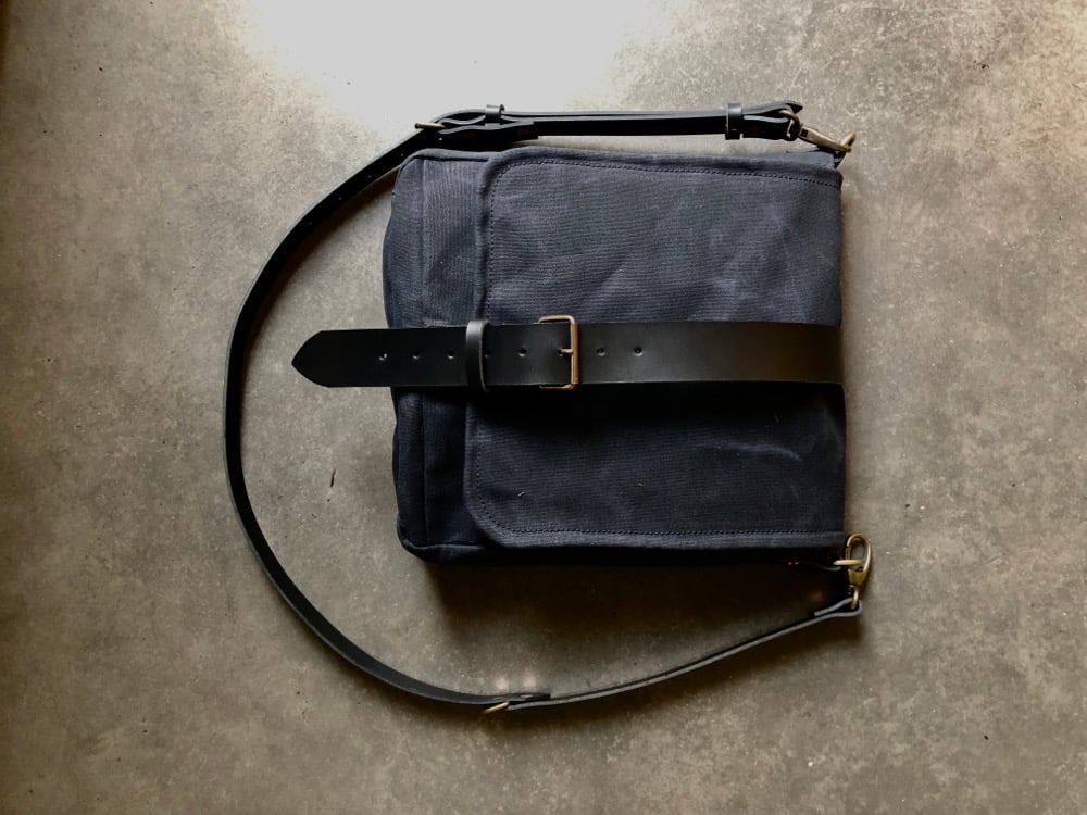 Image of Mens messenger bag in waxed canvas with leather adjustable shoulder strap and closing flap
