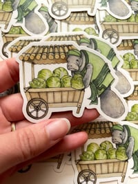 Image 1 of Cabbage Loving Manatee Sticker