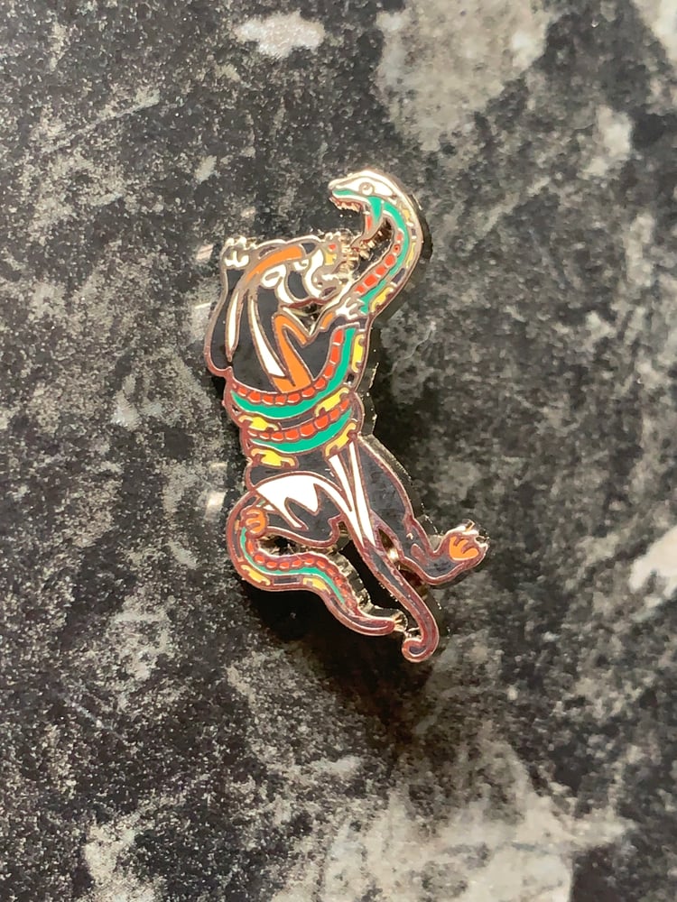 Image of Panther fighting a snake. Pin badge 
