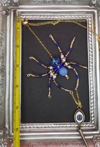 Image of Blue Spider Necklace with Evil Eye/Spike/Skull