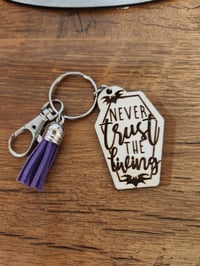 Image 1 of Never Trust the Living Spooky Coffin Wooden Keychain