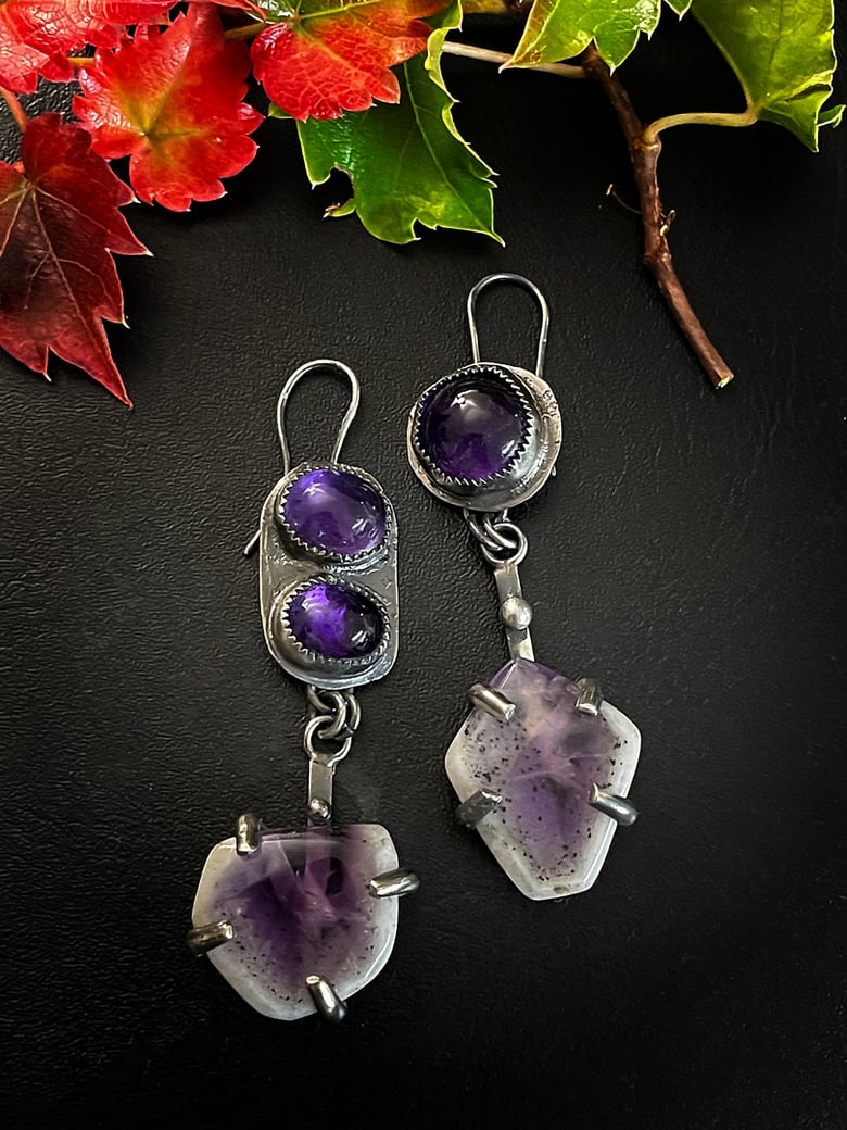 Image of non matching amethyst earrings