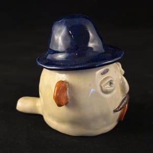 Image of Man in a Blue Fedora Whistle