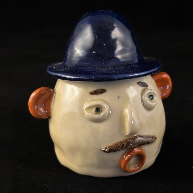 Image of Man in a Blue Fedora Whistle