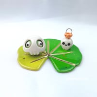 Image 2 of Frog on lily pad with skull mask and pumpkin skull lantern ceramic figurine