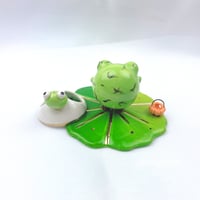 Image 5 of Zombie frog on lily pad with skull mask and pumpkin lantern ceramic figurine